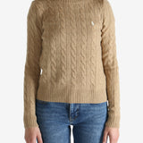 Tan pullover worn by a person, showing the pullover's fit