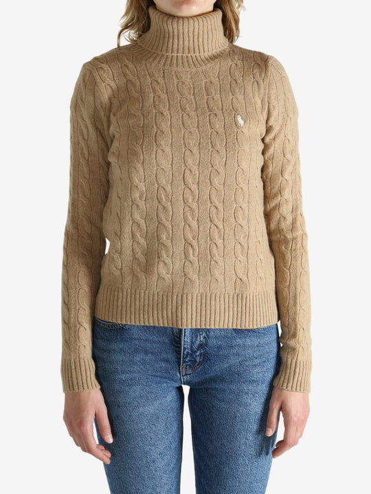 Tan pullover worn by a person, showing the pullover's fit