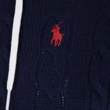 Close up of Navy knitwear, showing texture of the cotton fabric