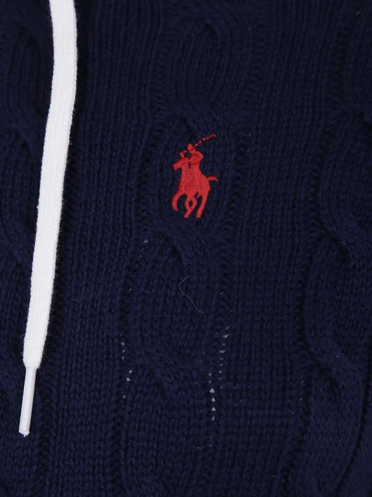 Close up of Navy knitwear, showing texture of the cotton fabric