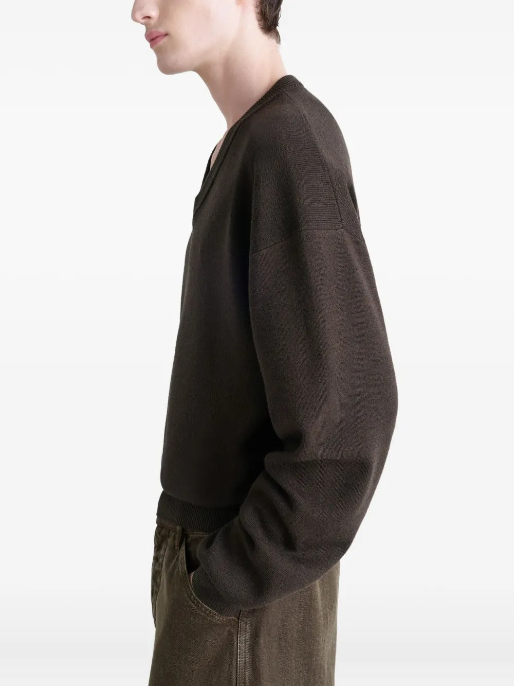 Brown sweater worn by a person, showing the sweater's fit