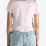 Pink t-shirt worn by a person, showing the shirt's fit
