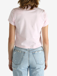 Pink t-shirt worn by a person, showing the shirt's fit