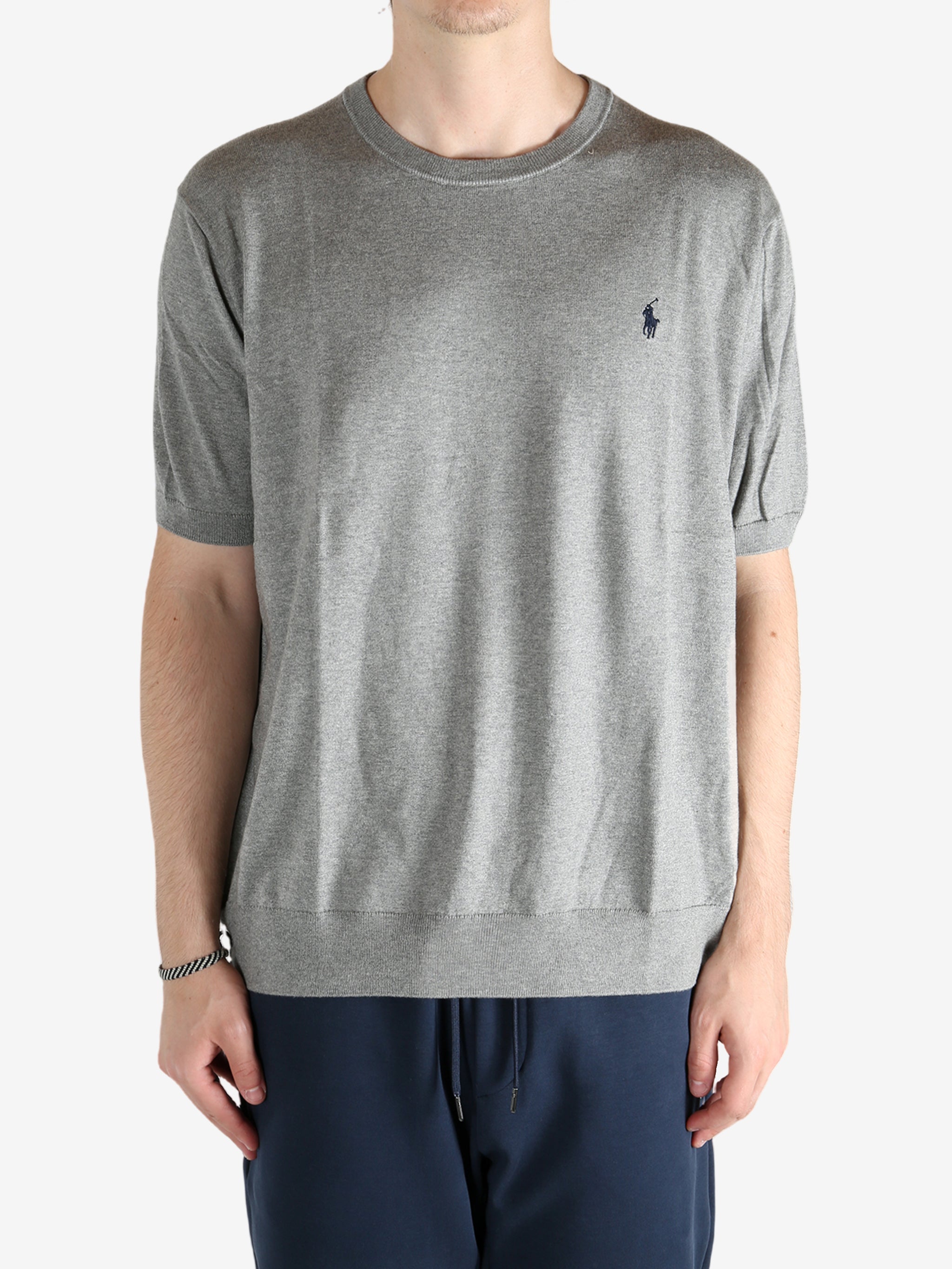 Grey sweater worn by a person, showing the sweater fit