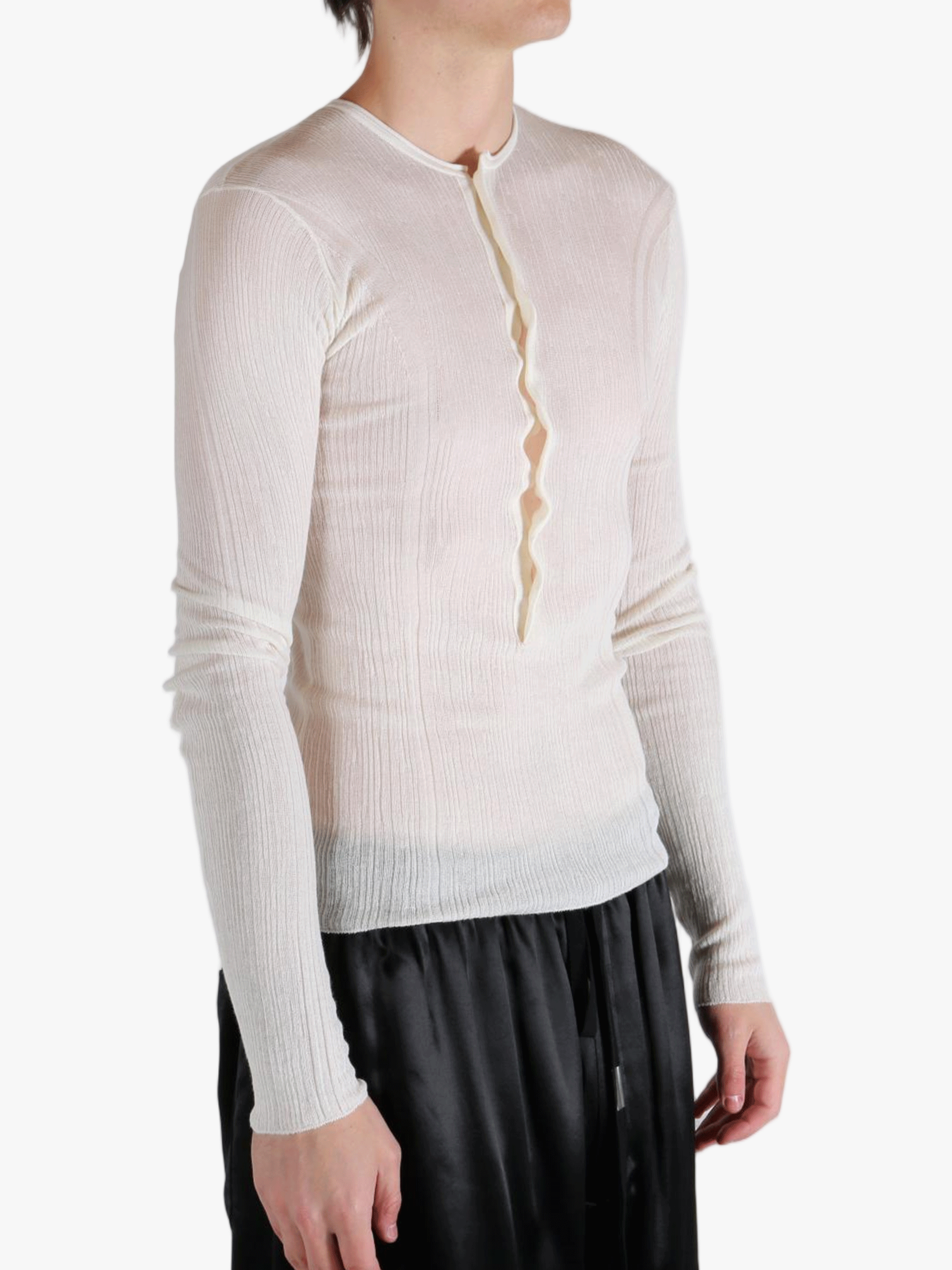 White top worn by a person, showing the top fit