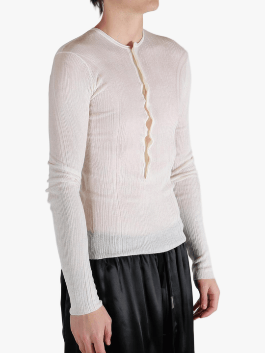 White top worn by a person, showing the top fit