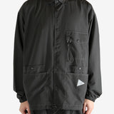 Black jacket worn by a person, showing the jacket fit