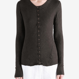 Brown knitwear worn by a person, showing the knitwear fit