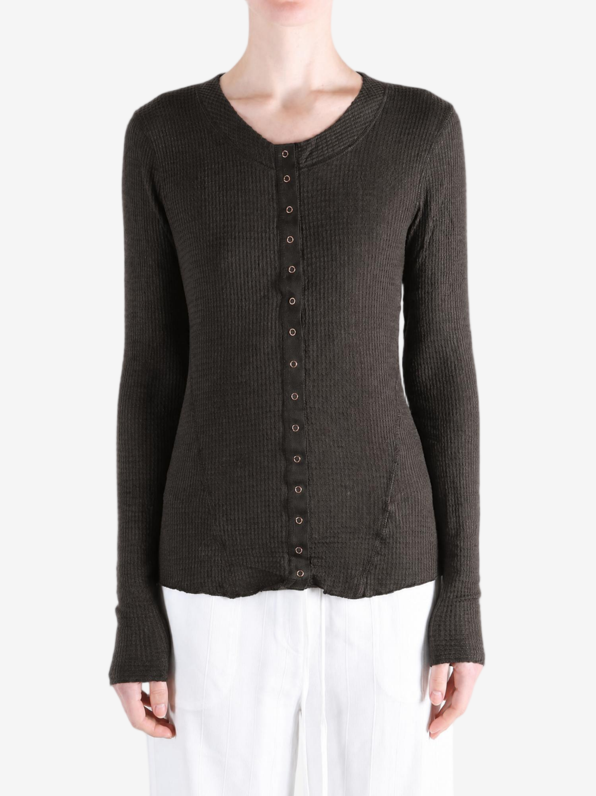Brown knitwear worn by a person, showing the knitwear fit