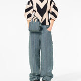 Blue bag worn by a person, showing the bag's fit