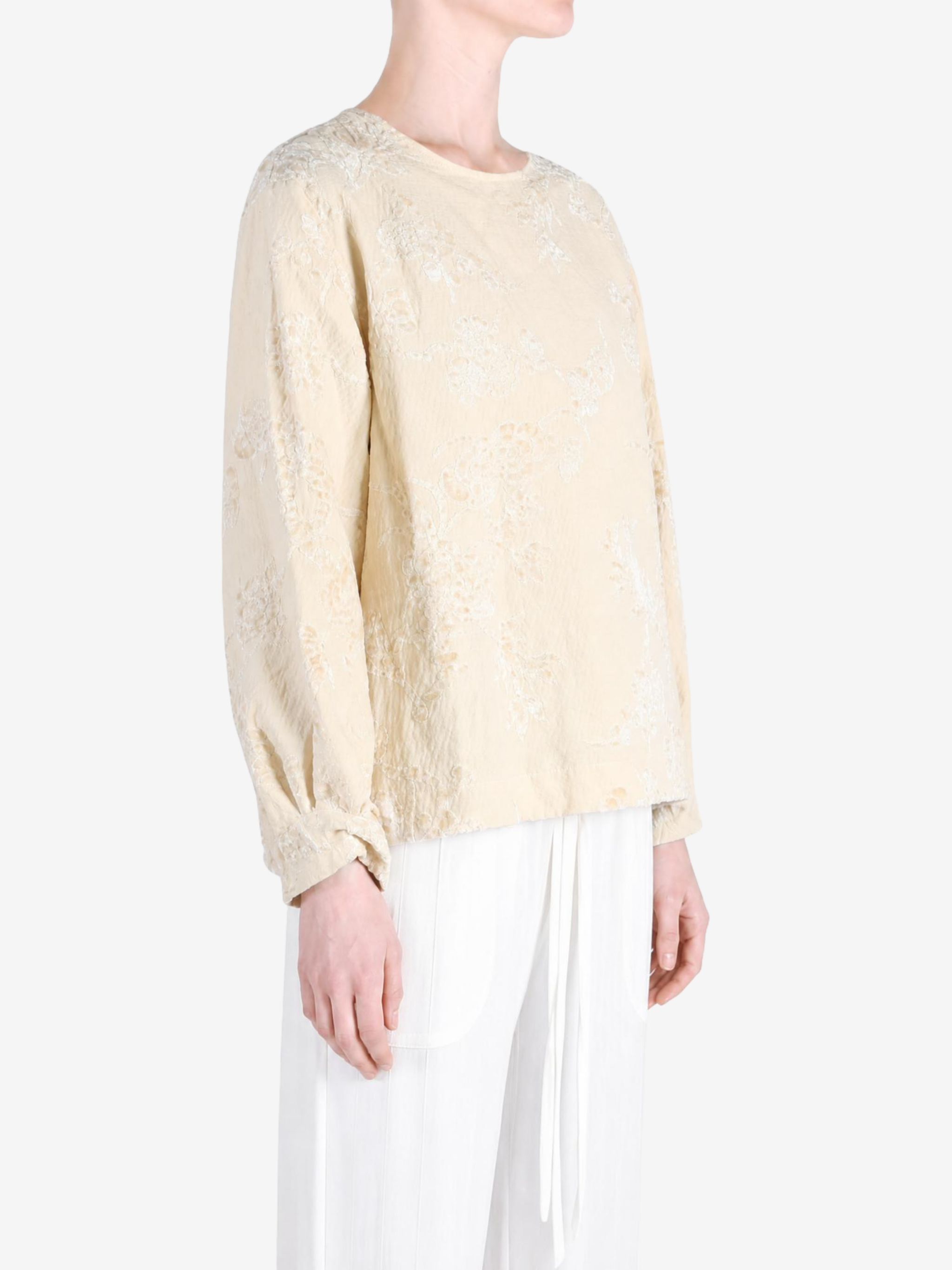 Tan top worn by a person, showing the top fit
