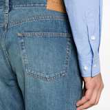 Close up of the blue pants, showing texture of the cotton fabric