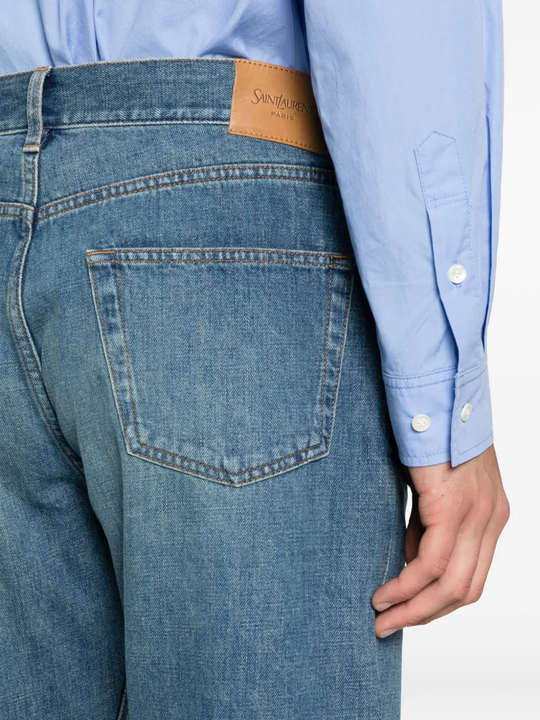 Close up of the blue pants, showing texture of the cotton fabric