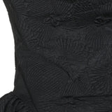 Close up of Black dress, showing texture of the 89% polyester/ 11% polyamide fabric