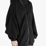 black sweats-hoodies worn by a person, showing the sweats-hoodies  fit