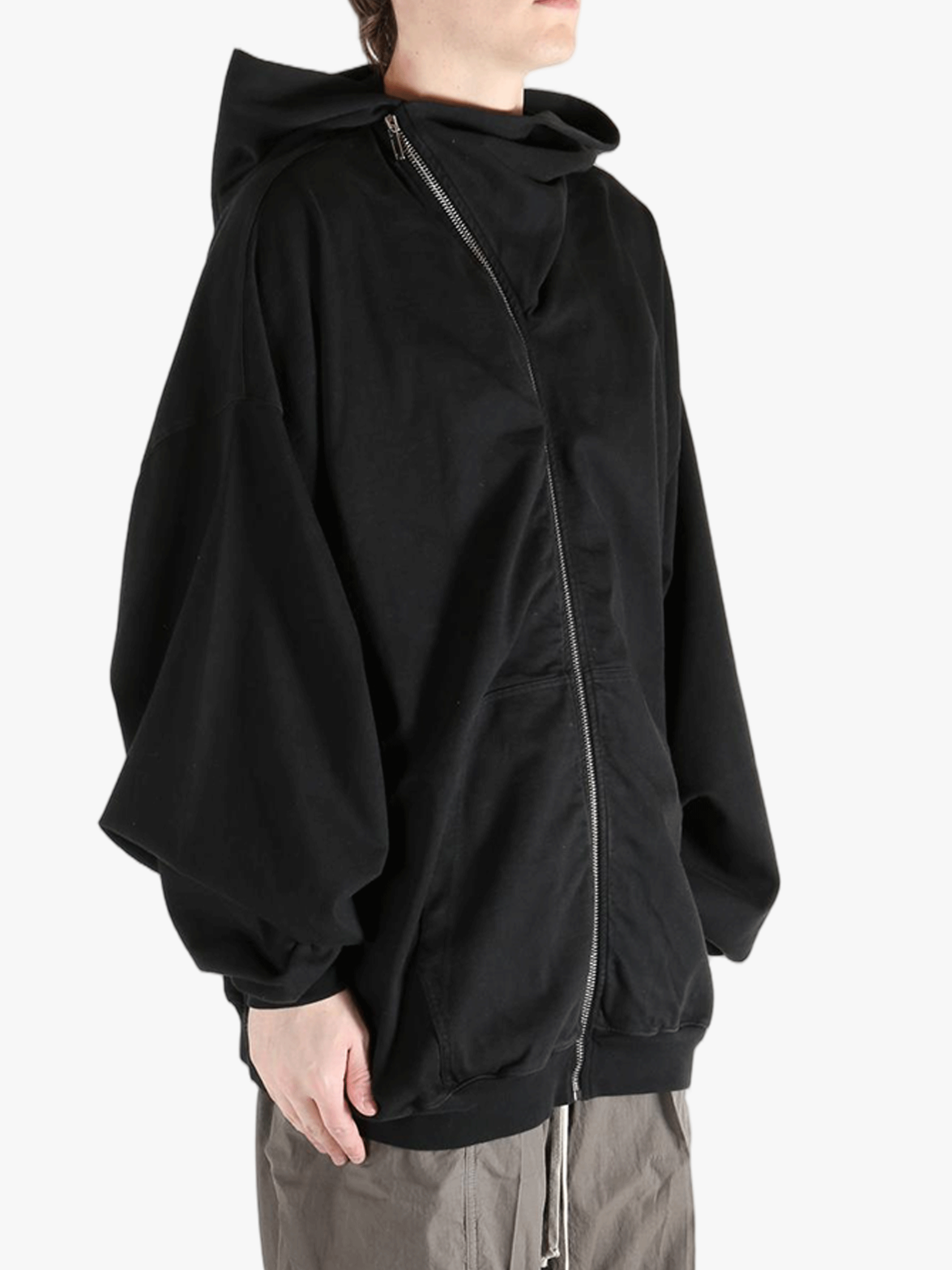 black sweats-hoodies worn by a person, showing the sweats-hoodies  fit