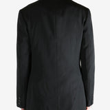 Black jacket worn by a person, showing the jacket's fit