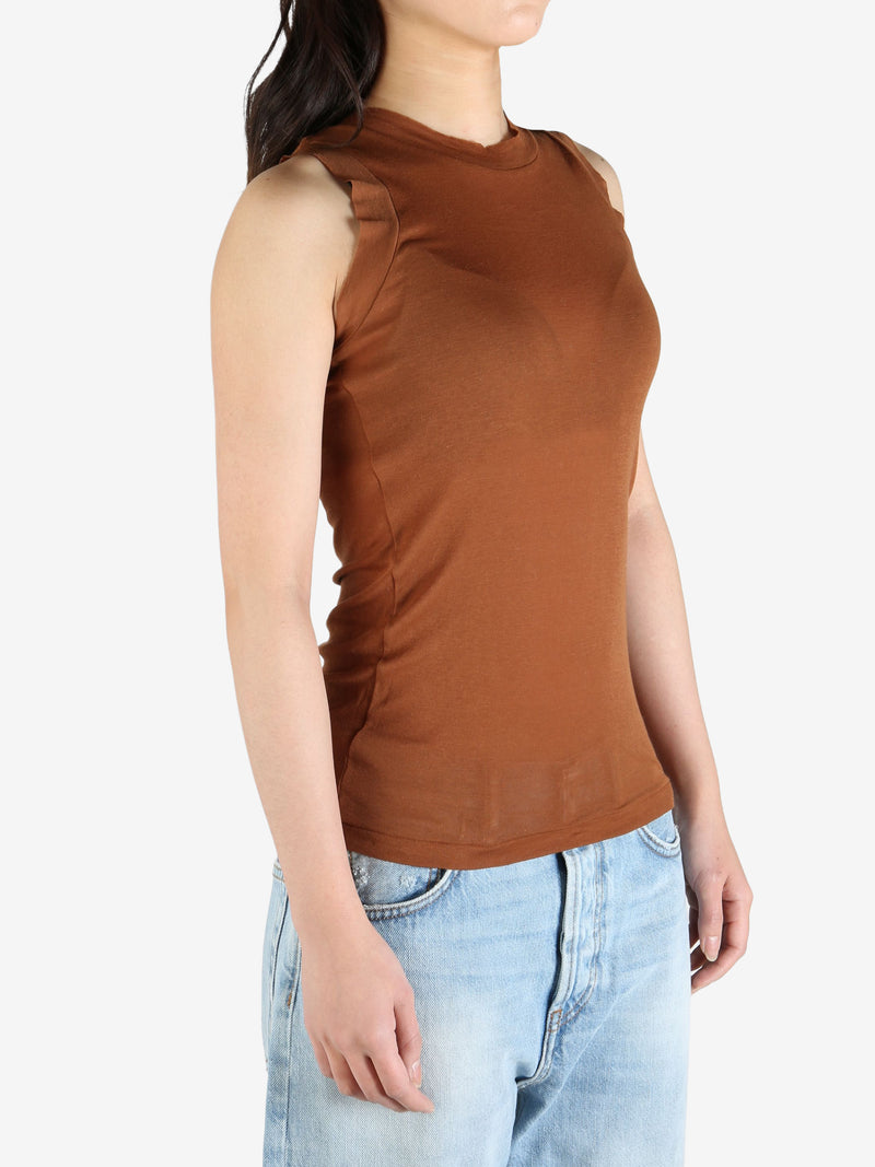 Brown top worn by a person, showing the top's fit