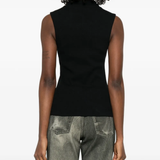 Black top worn by a person, showing the top fit