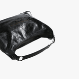 Close up of black handbag,showing texture of the lambskin fabric