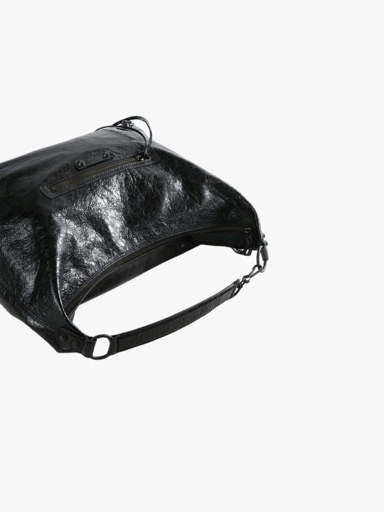 Close up of black handbag,showing texture of the lambskin fabric