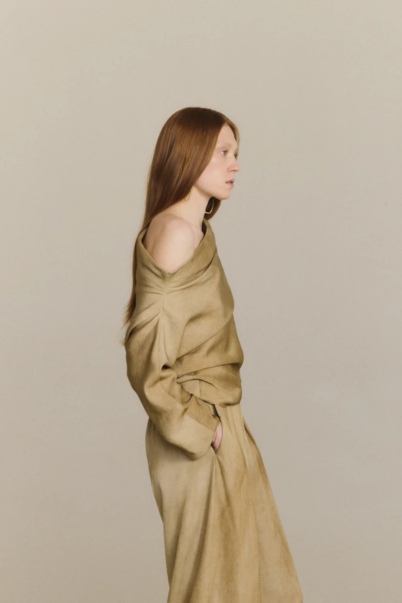 Brown top worn by a person, showing the top fit