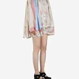 Tan shirt worn by a person, showing the shirt’s fit