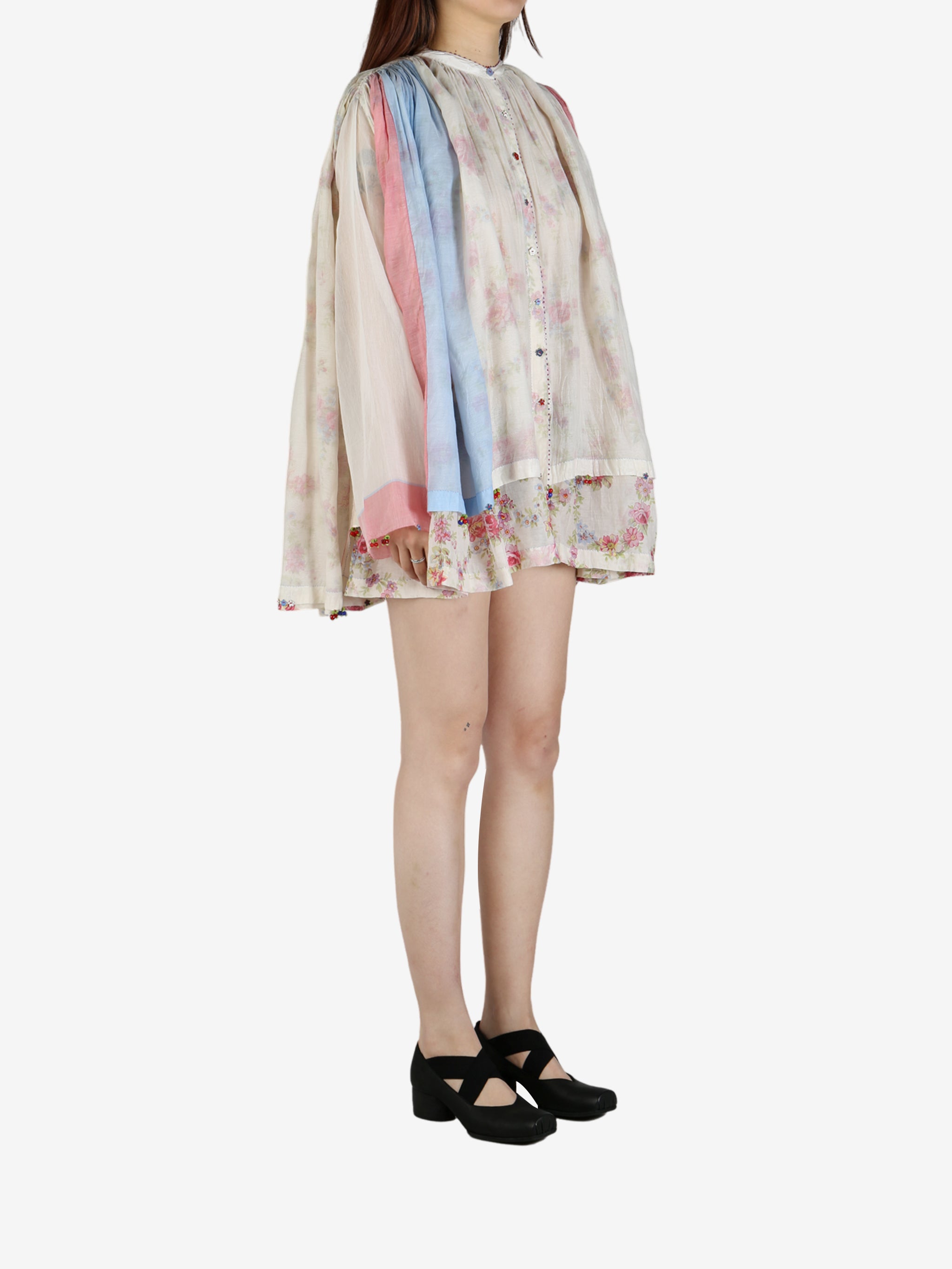 Tan shirt worn by a person, showing the shirt’s fit