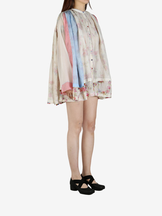 Tan shirt worn by a person, showing the shirt’s fit