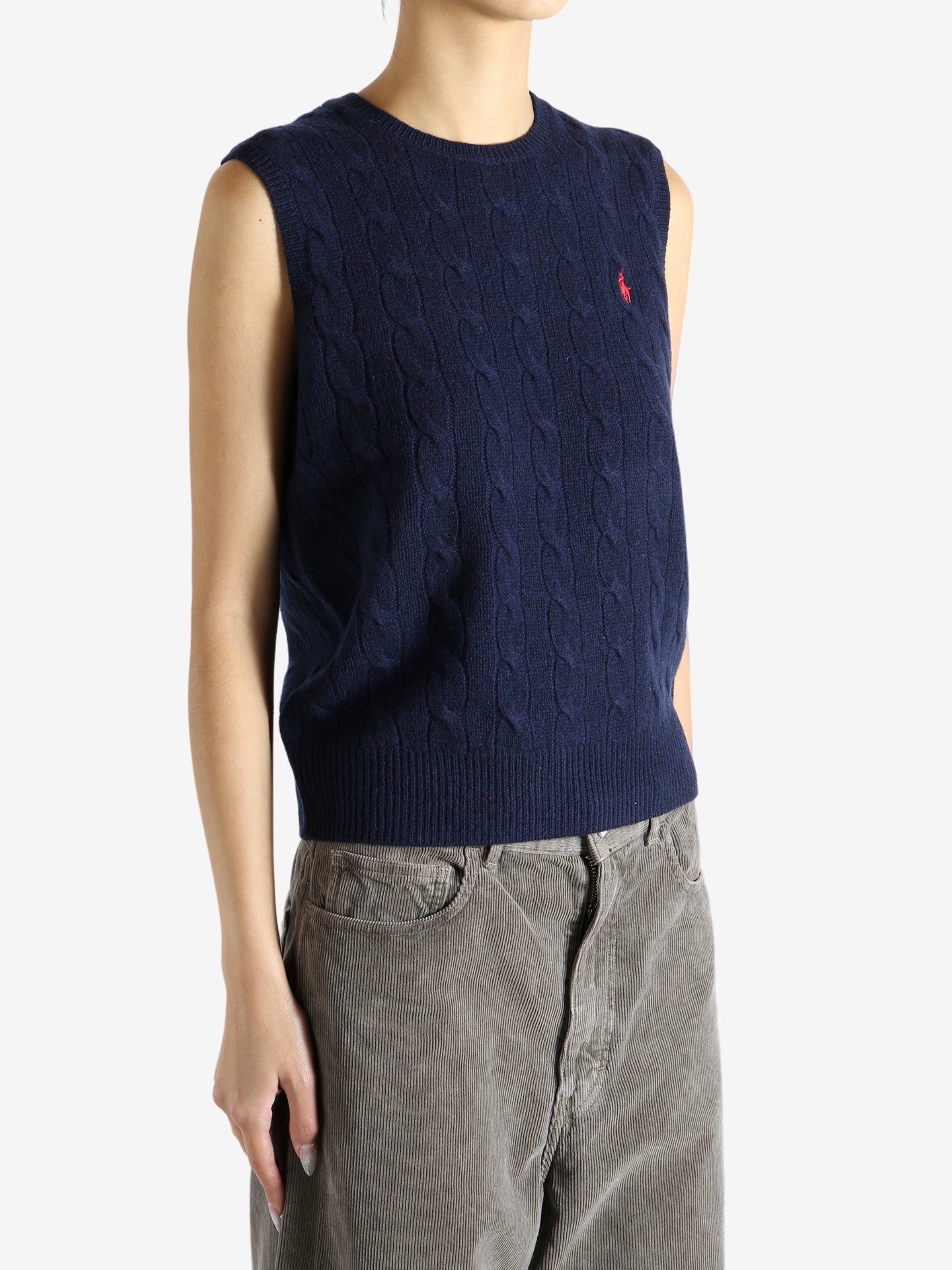 Navy sweater worn by a person, showing the sweater's fit