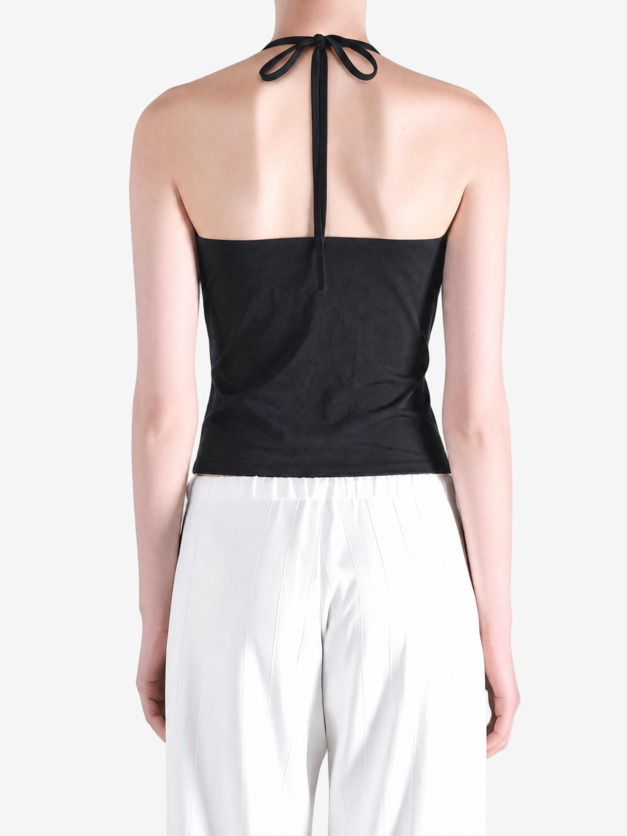 BLack tops worn a person,showing the tops fit