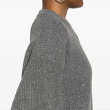 Close up of the grey knitwear, showing texture of the cashmere and wool fabric