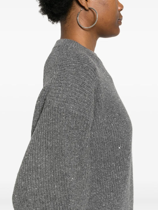 Close up of the grey knitwear, showing texture of the cashmere and wool fabric