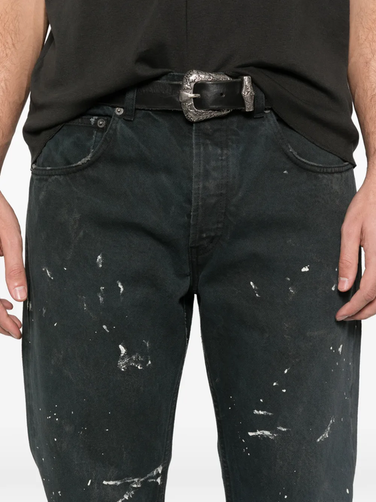 lose up of black jeans, showing texture of the cotton fabric