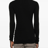 Black t-shirt worn by a person, showing the shirt's fit