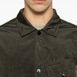 Green shirt worn by a person, showing the shirt fit
