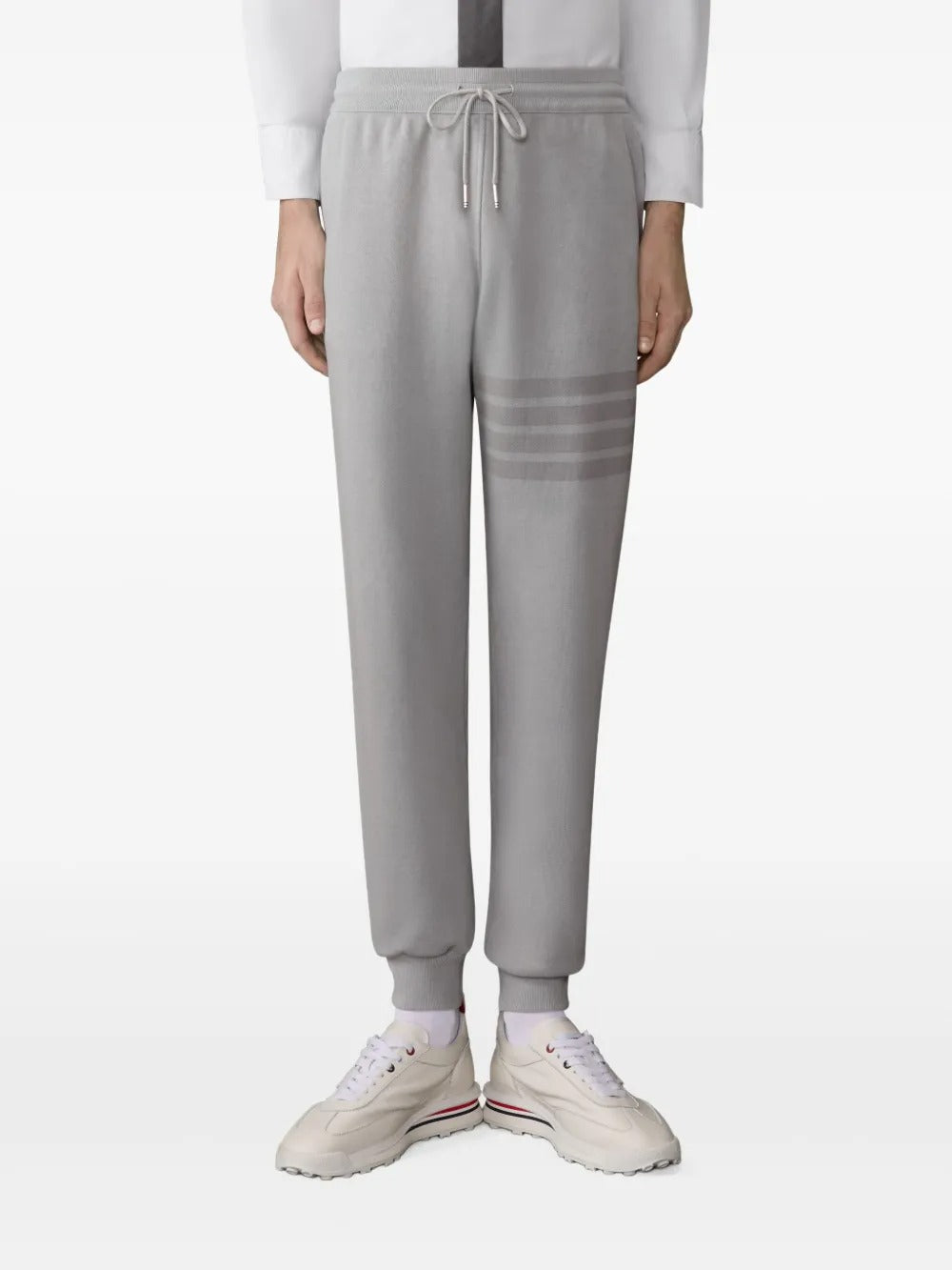 Grey pants worn by a person, showing the pants fit