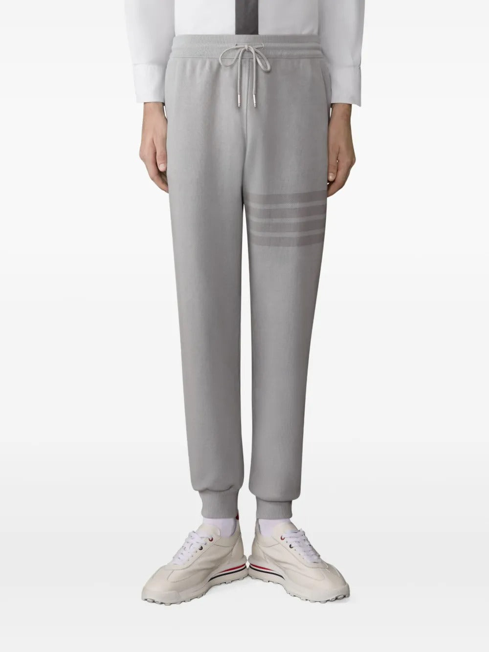 Grey pants worn by a person, showing the pants fit