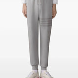 Grey pants worn by a person, showing the pants fit