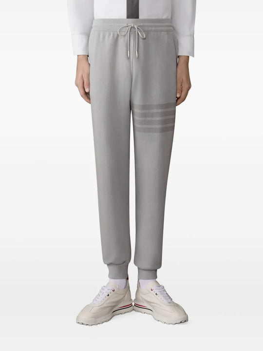 Grey pants worn by a person, showing the pants fit