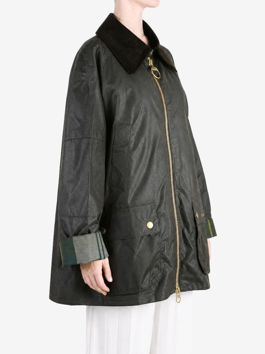 Green jacket worn by a person, showing the jacket fit