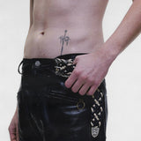 Black pants worn by a person, showing the pants fit