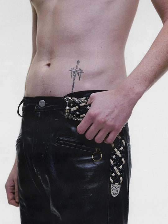 Black pants worn by a person, showing the pants fit