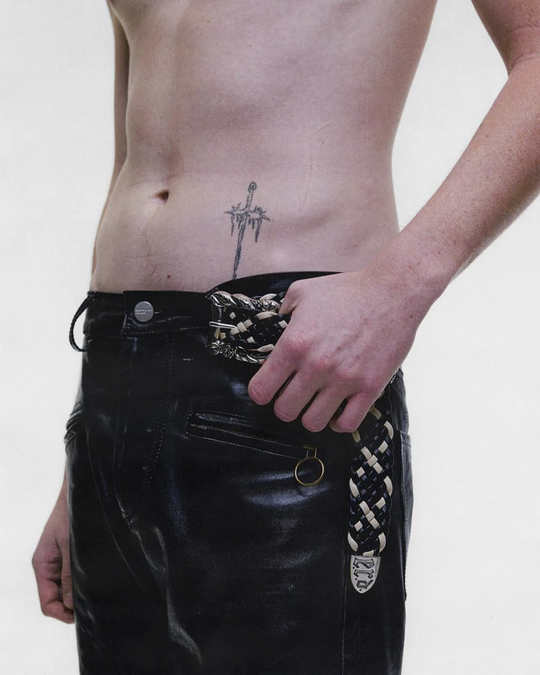Black pants worn by a person, showing the pants fit