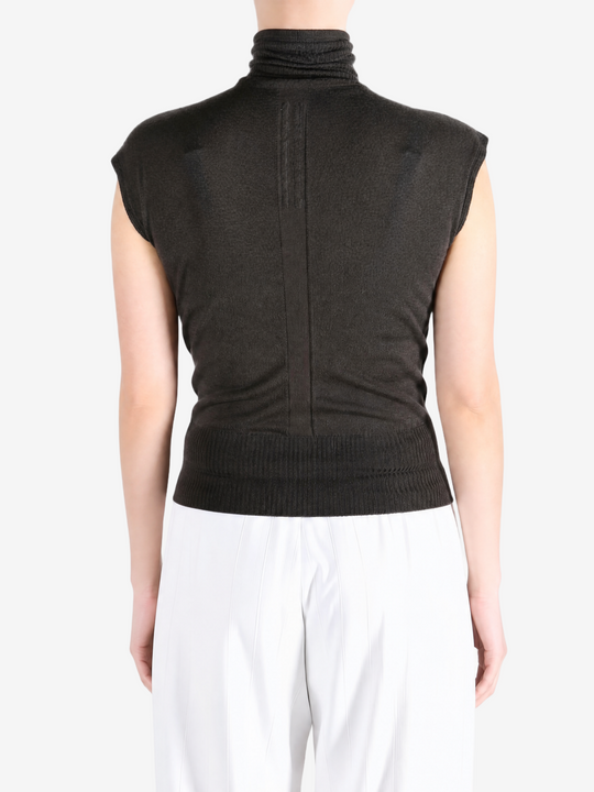 Brown top worn by a person, showing the top fit