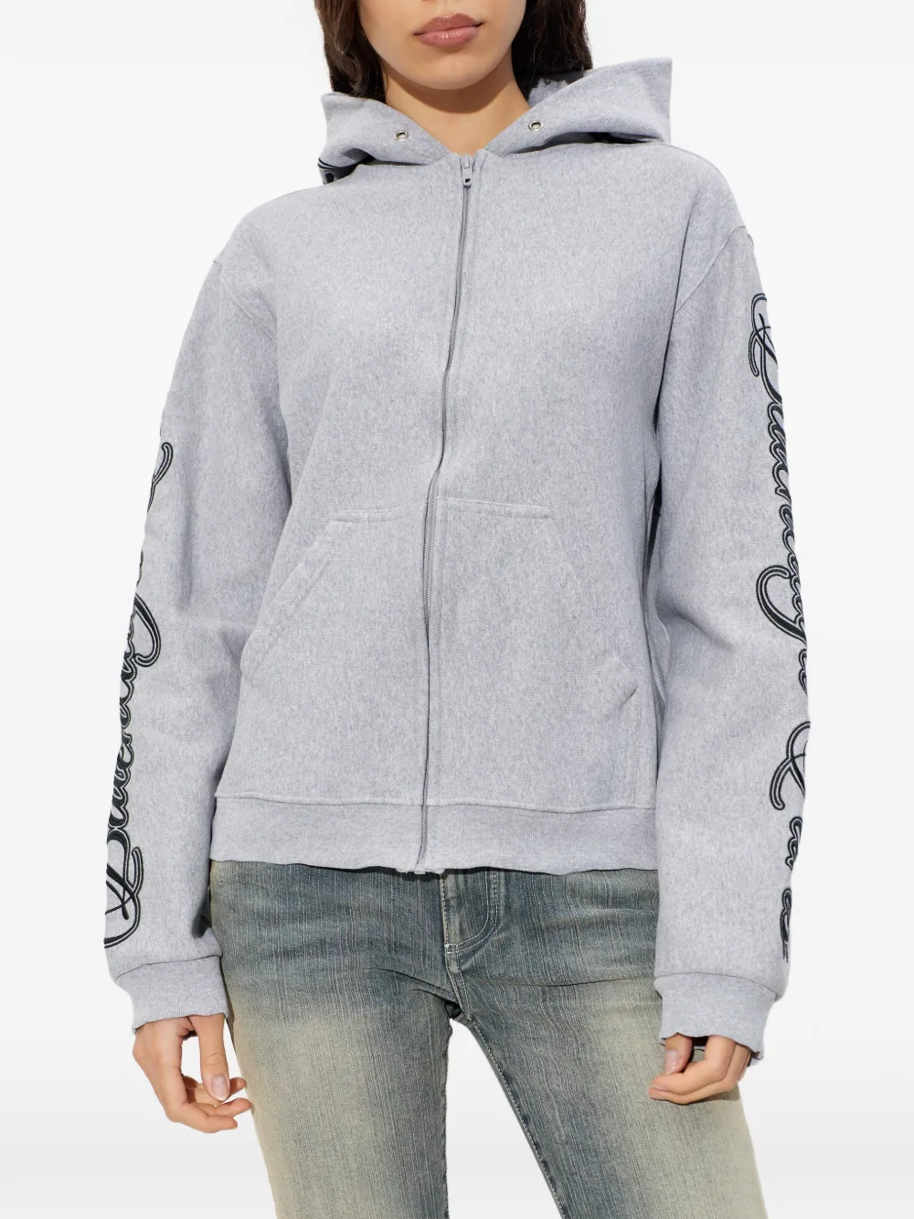 Grey sweats-hoodies worn by a person, showing the cotton fit
