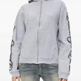 Grey sweats-hoodies worn by a person, showing the cotton fit