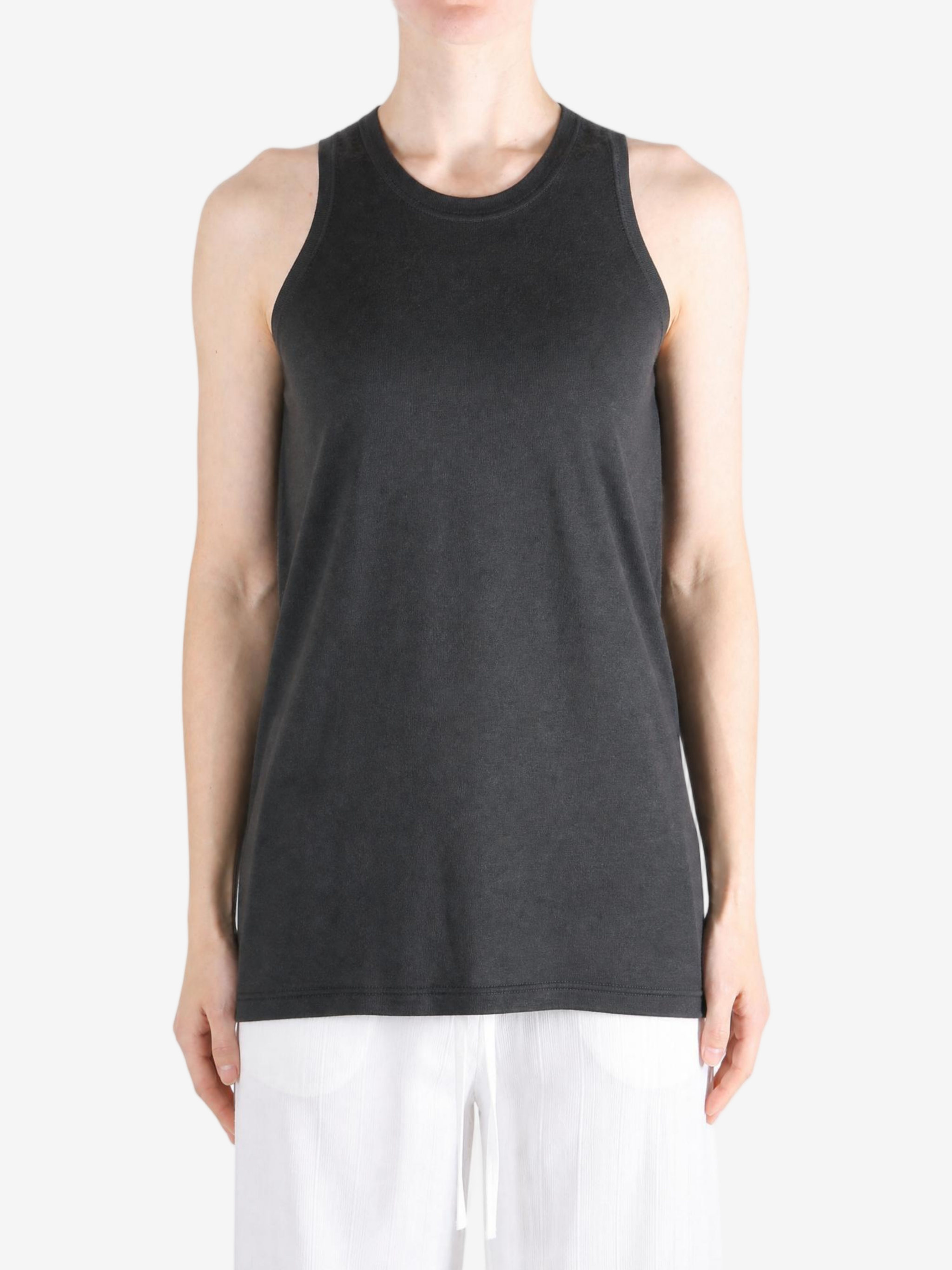 Black top worn by a person, showing the top fit