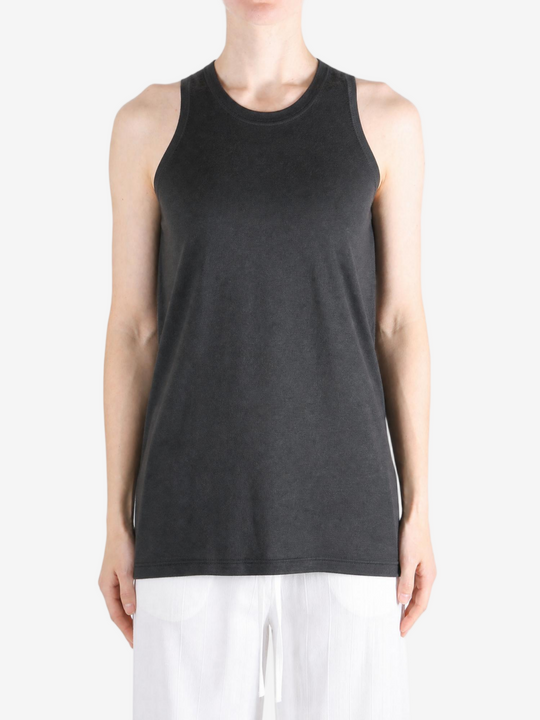 Black top worn by a person, showing the top fit