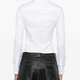 White shirt worn by a person, showing the shirt's fit